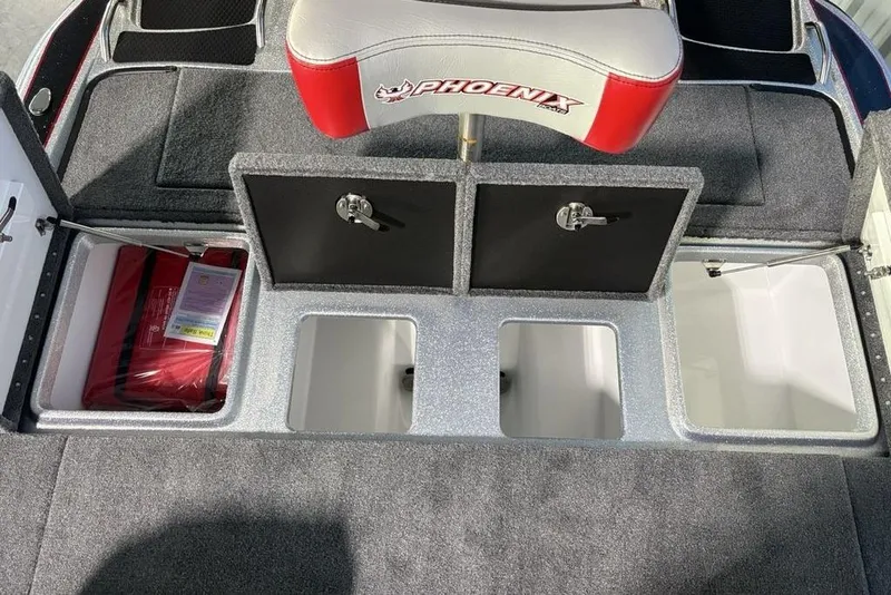 Slide: The Image of 2026 Phoenix 721 ZXL boat storage compartments with red life jacket and seating. - 29
