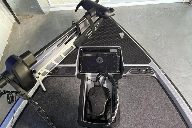 Slide: The Image of Front deck of 2026 Phoenix 721 ZXL boat with trolling motor and pedal. - 5