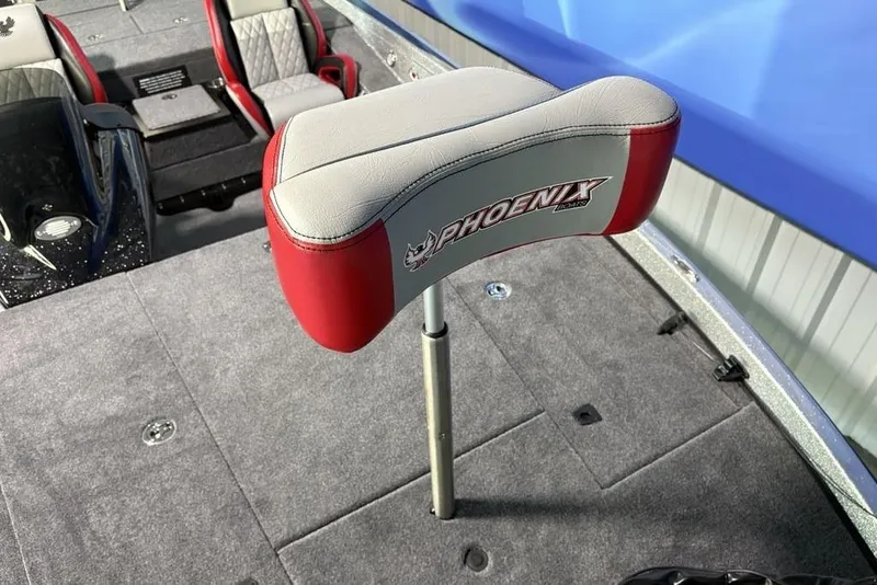 Slide: The Image of 2026 Phoenix 721 ZXL boat seat with red and gray upholstery on deck. - 7