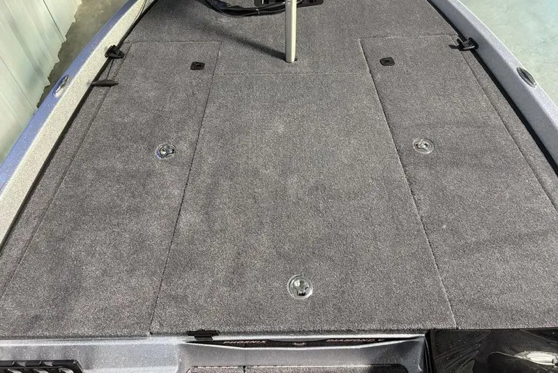 Slide: The Image of 2026 Phoenix 721 ZXL boat deck with gray carpet and storage compartments. - 9