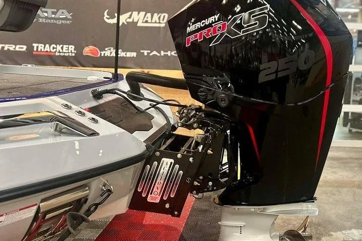 Slide: The Image of 2026 Ranger Z520R boat with Mercury Pro XS 250 engine at a showroom display. - 10