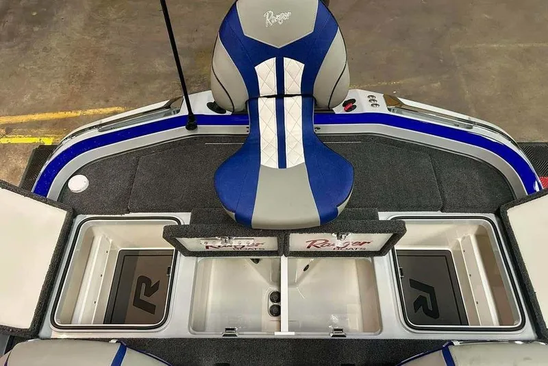 Slide: The Image of 2026 Ranger Z520R Ranger Cup Equipped boat interior with blue seat and storage compartments. - 14