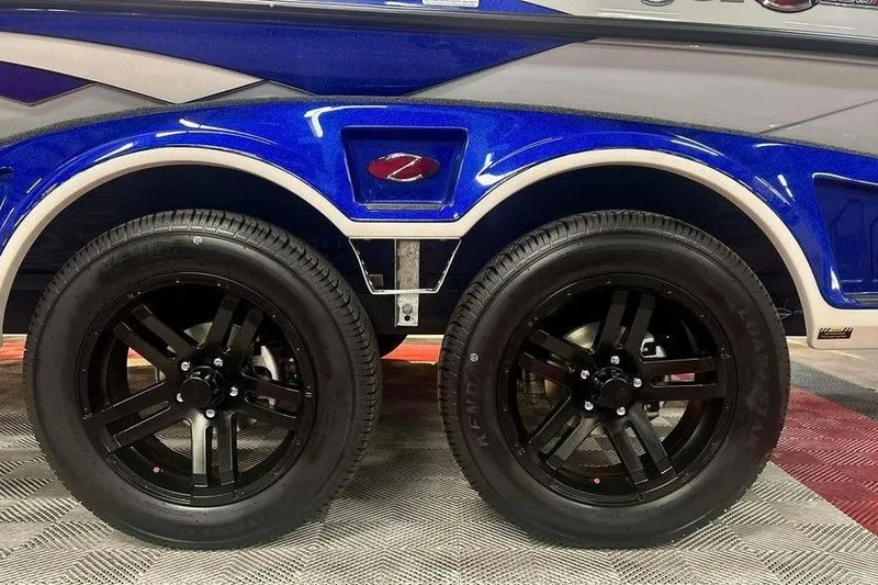 Slide: The Image of 2026 Ranger Z520R Ranger Cup trailer with black wheels and blue fender. - 15