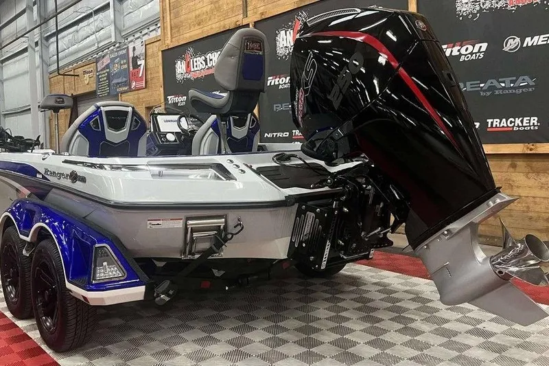 Slide: The Image of 2026 Ranger Z520R Ranger Cup Equipped boat with powerful outboard motor in showroom. - 9