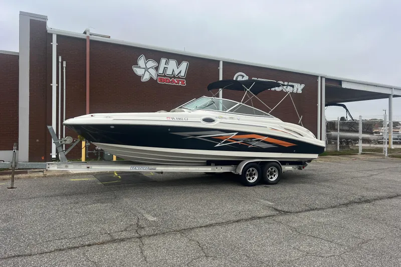 The Image of 2005 Sea Ray 270 Sundeck boat on trailer outside HM Boats dealership. - 0