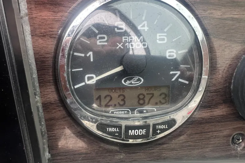 Slide: The Image of Close-up of 2005 Sea Ray 270 Sundeck tachometer showing 12.3 volts and 87.3 hours. - 16