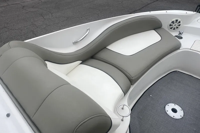 Slide: The Image of 2005 Sea Ray 270 Sundeck boat interior with gray and white cushioned seating. - 22