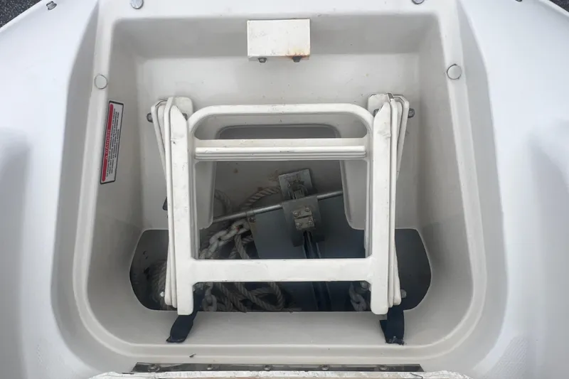Slide: The Image of 2005 Sea Ray 270 Sundeck anchor storage with ladder and ropes. - 24
