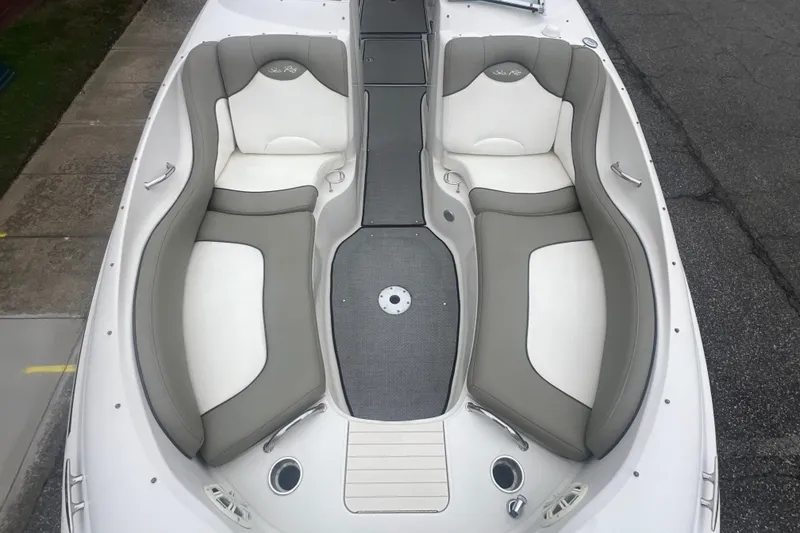 Slide: The Image of 2005 Sea Ray 270 Sundeck boat with spacious seating and sleek design. - 27
