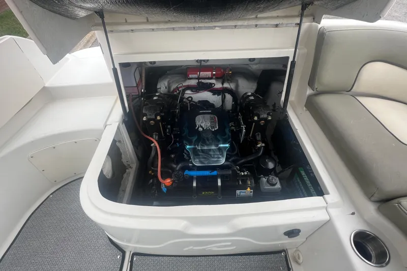 Slide: The Image of Engine compartment of a 2005 Sea Ray 270 Sundeck boat, showcasing detailed components. - 32