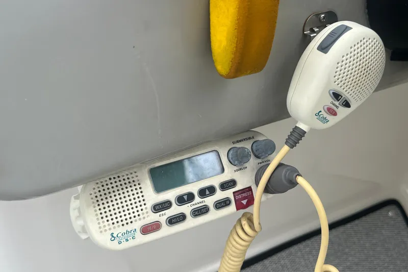 Slide: The Image of Cobra Marine radio on 2005 Sea Ray 270 Sundeck boat dashboard. - 35