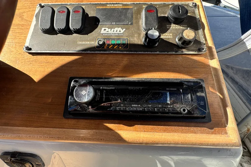 Slide: The Image of Control panel of a 2008 Duffy Snug Harbor boat with audio system. - 10