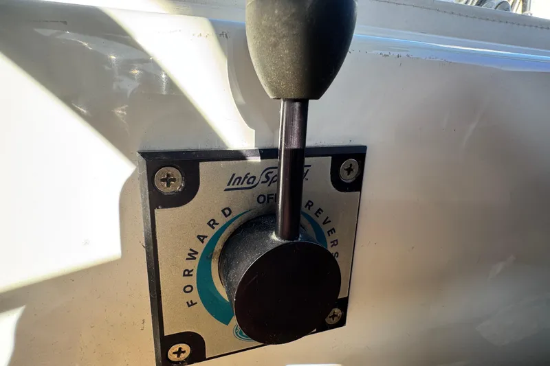 Slide: The Image of Throttle control lever on a 2008 Duffy Snug Harbor boat, showing forward and reverse settings. - 14