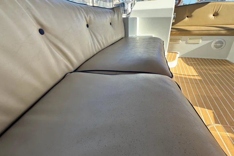 Slide: The Image of Luxurious seating on 2008 Duffy Snug Harbor boat with beige upholstery and wooden flooring. - 8