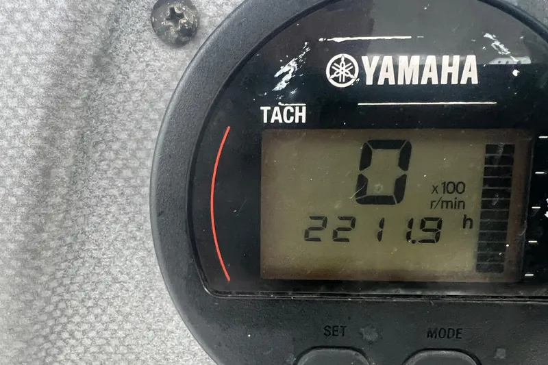 Slide: The Image of Yamaha tachometer displaying 2211.9 hours on a 2013 Tidewater 216 CC Adventure boat. - 19