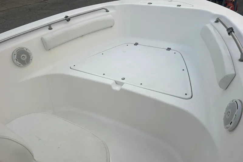 Slide: The Image of 2013 Tidewater 216 CC Adventure boat interior with seating and storage. - 24