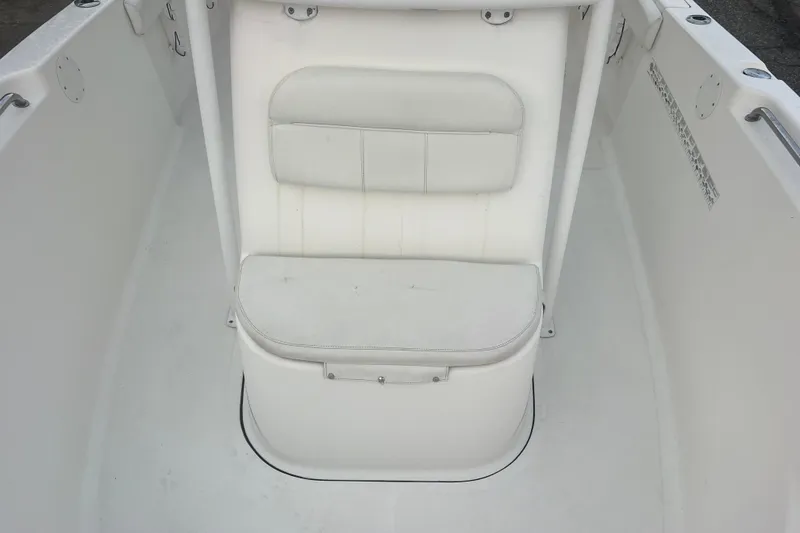 Slide: The Image of 2013 Tidewater 216 CC Adventure boat interior with white cushioned seating. - 29