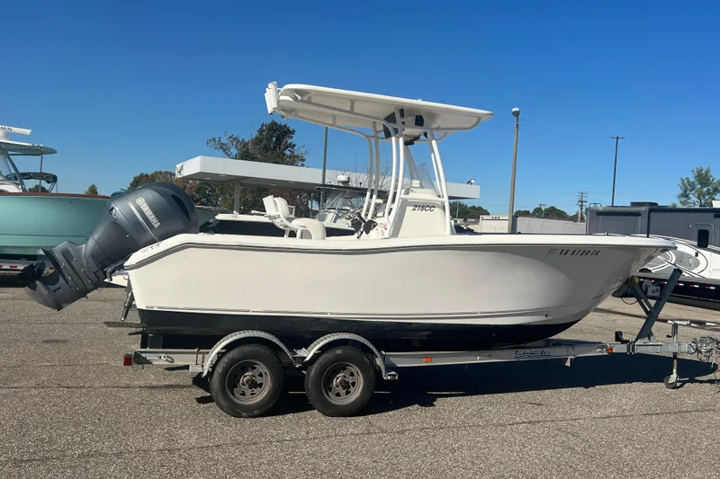 Slide: The Image of 2013 Tidewater 216 CC Adventure boat on trailer, featuring Yamaha outboard motor. - 3