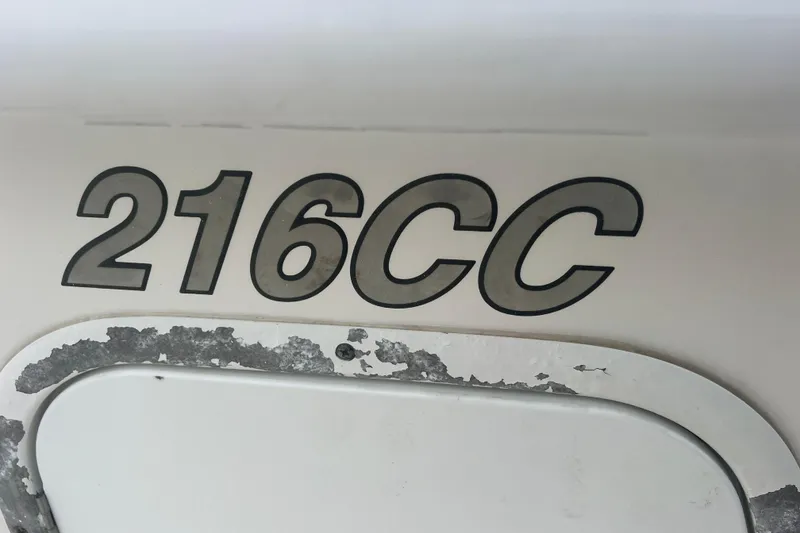Slide: The Image of 2013 Tidewater 216 CC Adventure boat model decal with weathered surface. - 36