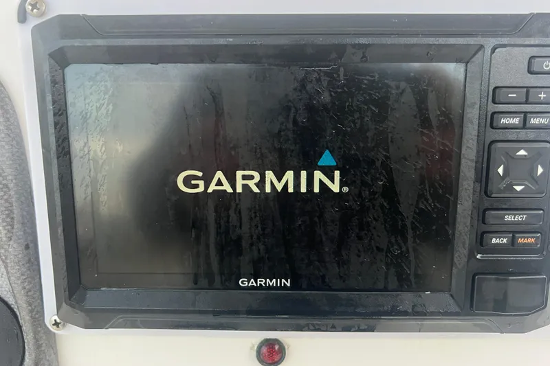 Slide: The Image of Garmin navigation system on 2013 Tidewater 216 CC Adventure boat dashboard. - 37