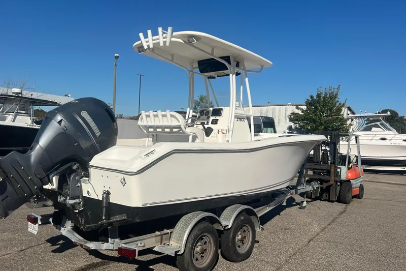 Slide: The Image of 2013 Tidewater 216 CC Adventure boat on trailer with Yamaha outboard motor. - 4