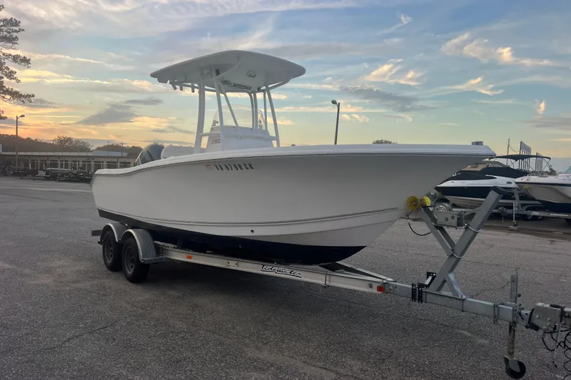 Slide: The Image of 2013 Tidewater 216 CC Adventure boat on trailer at sunset. - 42