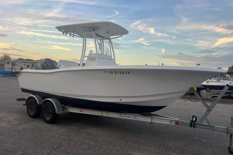 Slide: The Image of 2013 Tidewater 216 CC Adventure boat on trailer at sunset. - 43