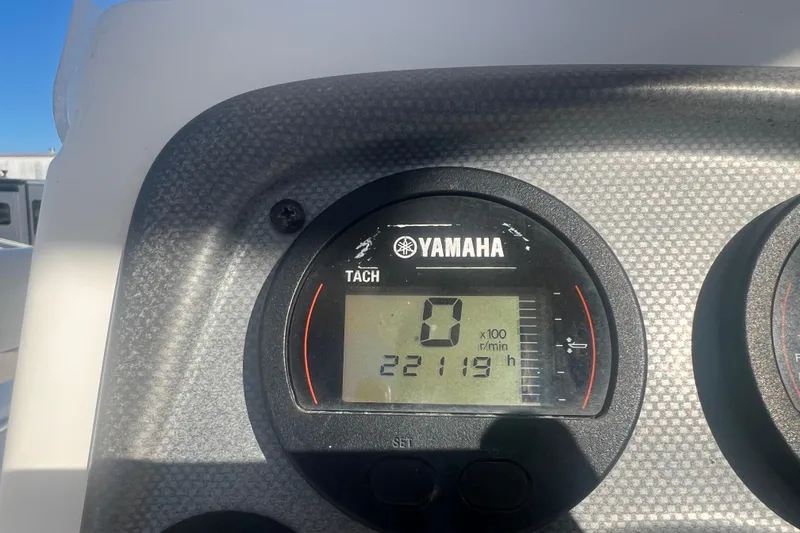 Slide: The Image of Yamaha tachometer displaying 2219 hours on a 2013 Tidewater 216 CC Adventure boat. - 9