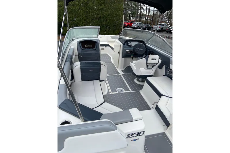 Slide: The Image of 2021 Chaparral 230 Suncoast boat interior with seating and helm. - 11