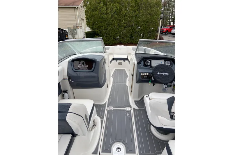 Slide: The Image of 2021 Chaparral 230 Suncoast boat interior with modern dashboard and seating. - 13
