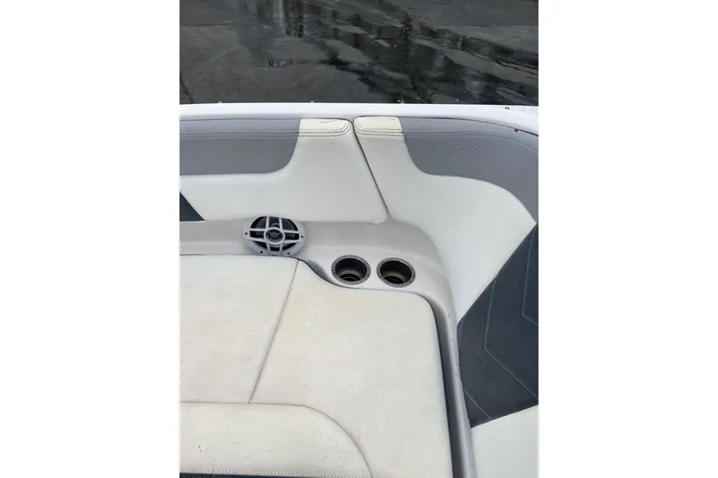 Slide: The Image of Interior of 2021 Chaparral 230 Suncoast boat with seating and cup holders. - 18
