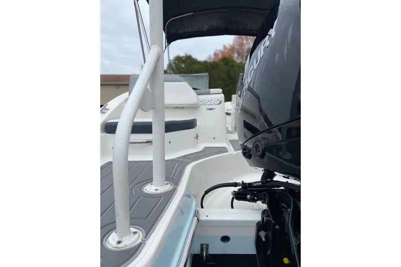 Slide: The Image of 2021 Chaparral 230 Suncoast boat with Mercury engine, rear view. - 6