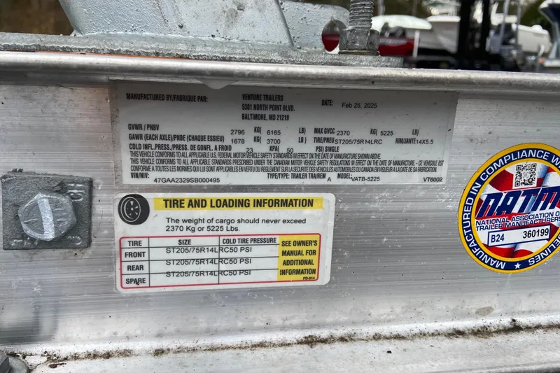 Slide: The Image of 2021 Chaparral 230 Suncoast trailer label with tire and loading information. - 8