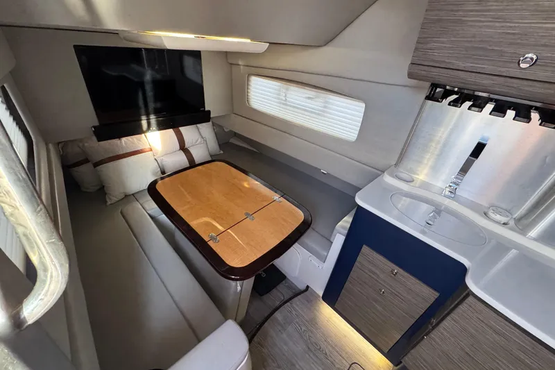 Slide: The Image of Luxurious interior of 2019 Scout 420 LXF boat with seating, table, and kitchenette. - 47
