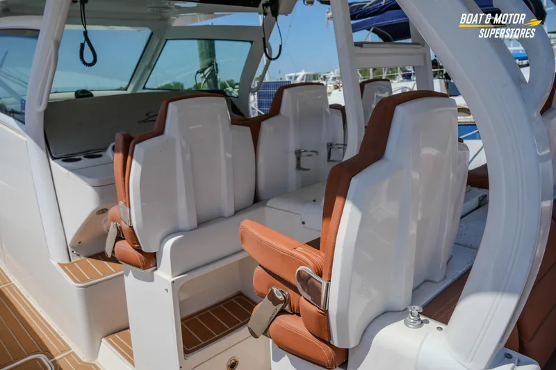 Slide: The Image of 2019 Scout 420 LXF boat interior with luxurious seating and modern design. - 53
