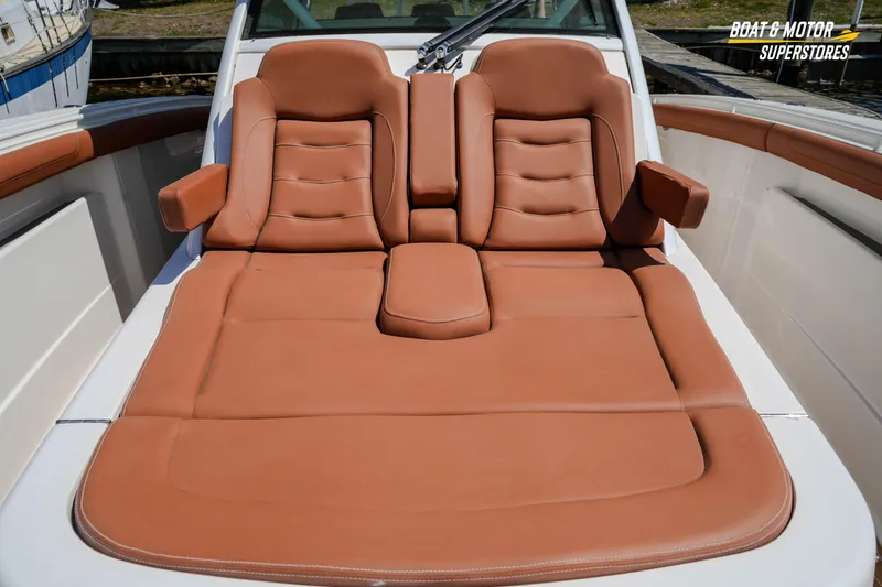 Slide: The Image of Luxurious tan leather seating on 2019 Scout 420 LXF boat deck. - 62