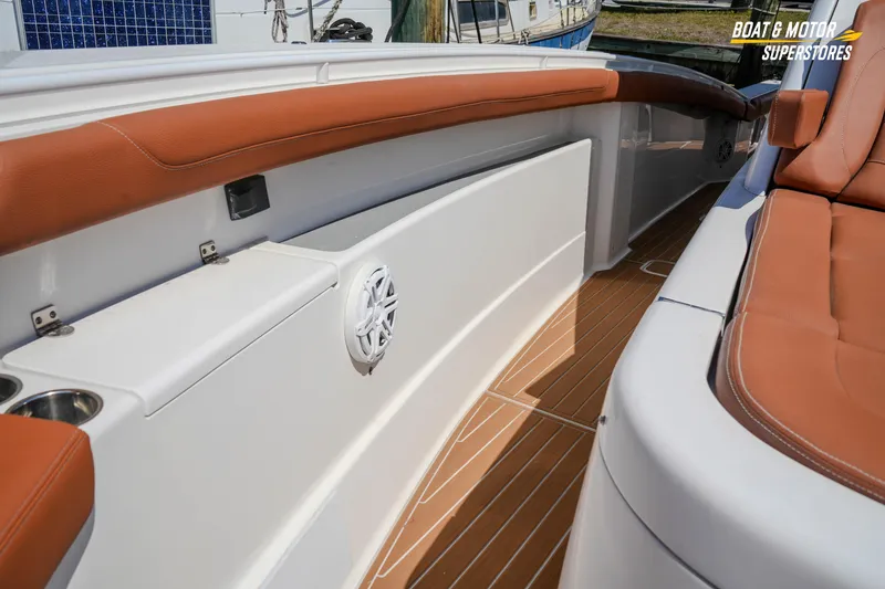 Slide: The Image of 2019 Scout 420 LXF boat interior with tan seating and teak flooring. - 66