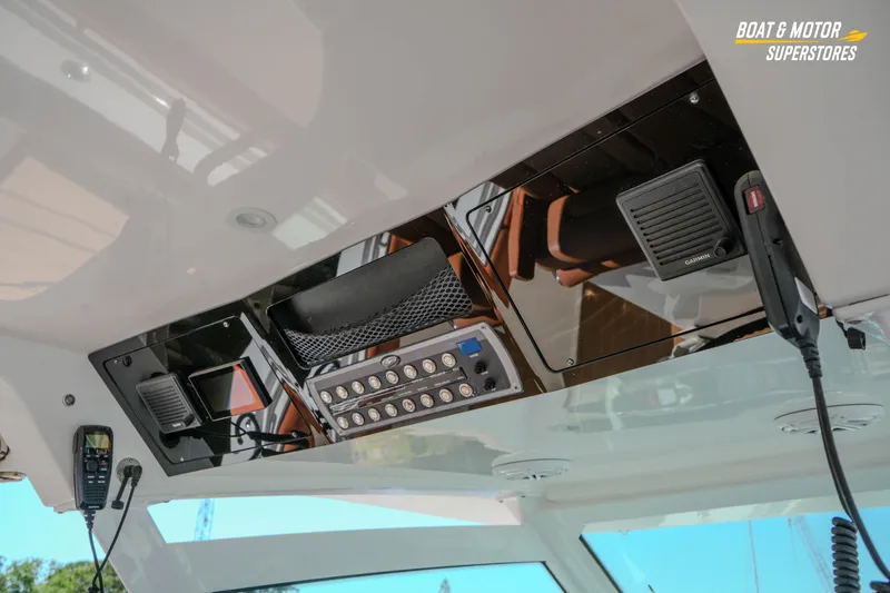 Slide: The Image of 2019 Scout 420 LXF boat dashboard with modern controls and communication devices. - 72