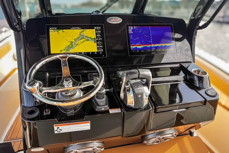 Slide: The Image of 2022 Scout 330 LXF helm with dual displays and modern controls. - 21