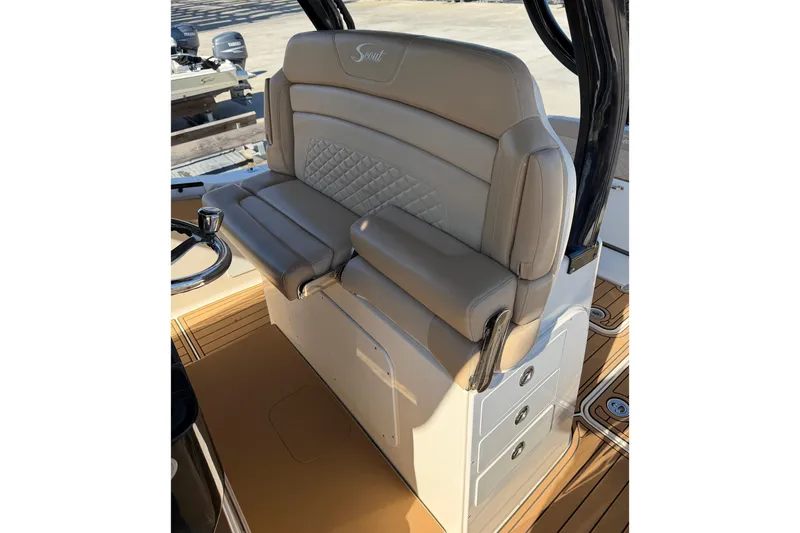 Slide: The Image of 2022 Scout 330 LXF boat seat with beige upholstery and diamond stitching. - 42