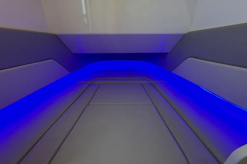 Slide: The Image of 2022 Scout 330 LXF interior with blue LED lighting and sleek seating design. - 56