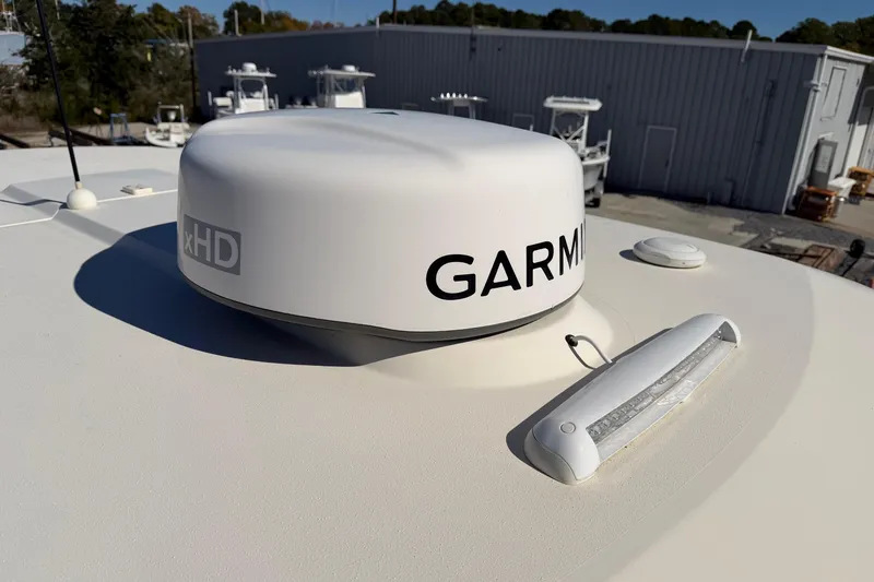 Slide: The Image of Garmin xHD radar on 2022 Scout 330 LXF boat, docked outdoors. - 67
