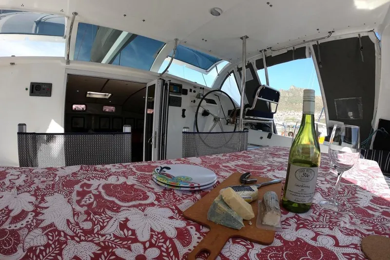 Slide: The Image of Luxurious 2006 Maxim Yachts 57 interior with wine, cheese, and scenic view. - 10