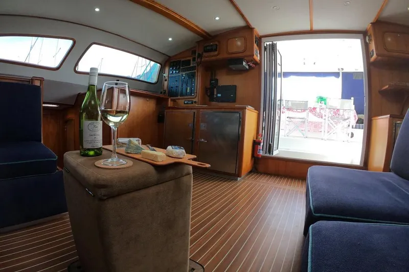 Slide: The Image of Luxurious interior of 2006 Maxim Yachts 57 with wine and cheese on table. - 13