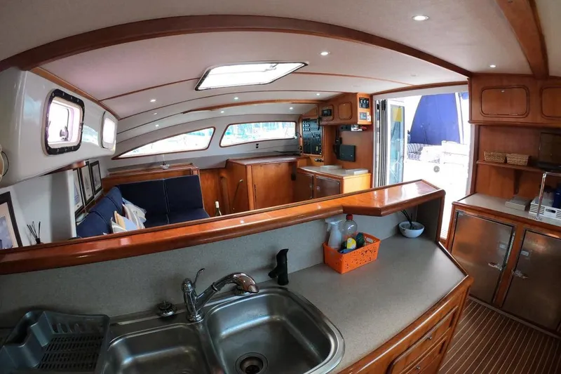 Slide: The Image of Interior of 2006 Maxim Yachts 57, featuring a spacious kitchen and seating area. - 19