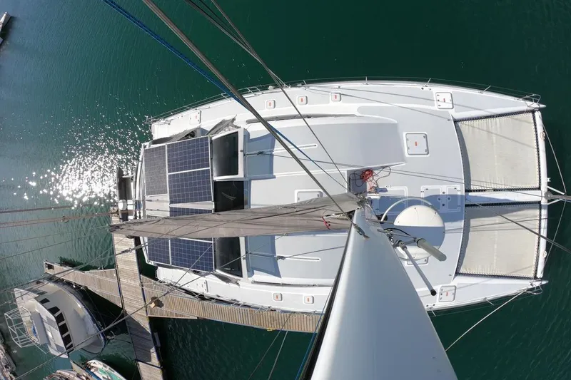 Slide: The Image of Aerial view of 2006 Maxim Yachts 57 catamaran with solar panels docked at marina. - 30