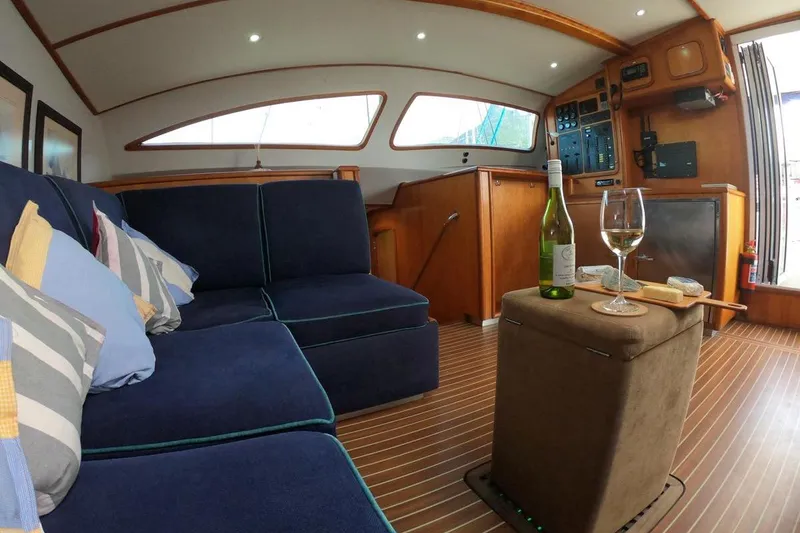 Slide: The Image of Luxurious interior of 2006 Maxim Yachts 57 with cozy seating and wine setup. - 12
