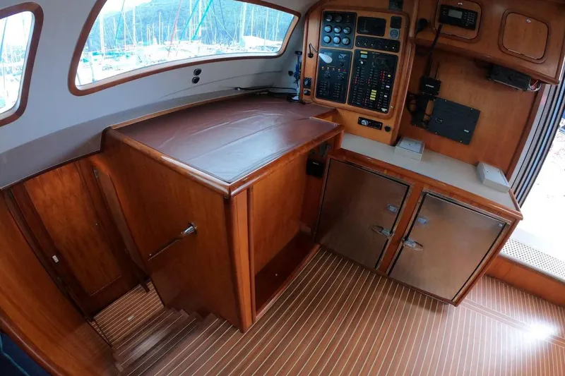 Slide: The Image of Interior of 2006 Maxim Yachts 57, featuring wooden cabinetry and control panel. - 18
