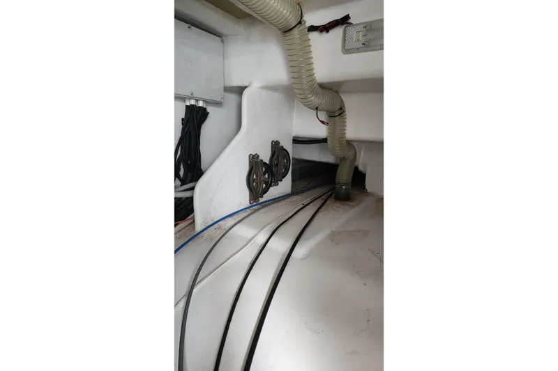 Slide: The Image of Engine room of 2006 Maxim Yachts 57, featuring hoses and wiring. - 41