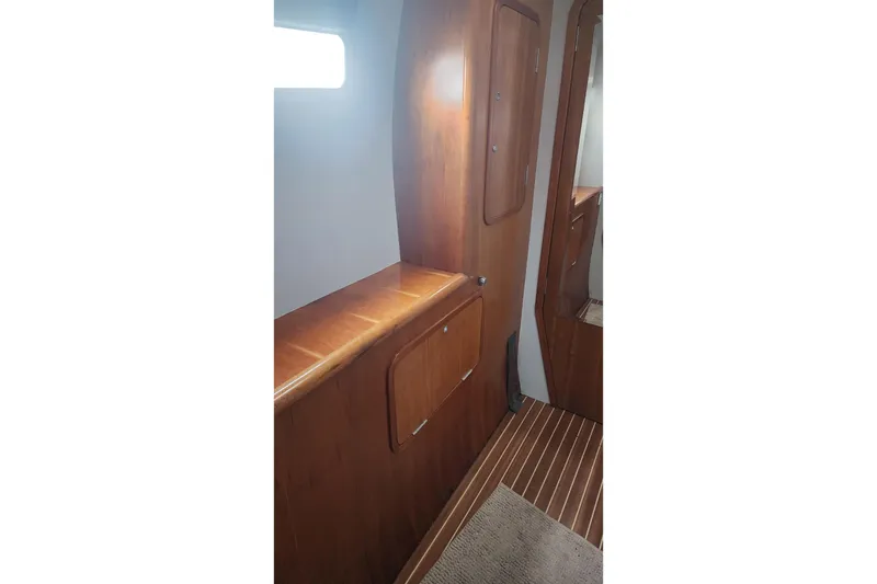 Slide: The Image of Interior of 2006 Maxim Yachts 57, featuring wooden cabinetry and flooring. - 43